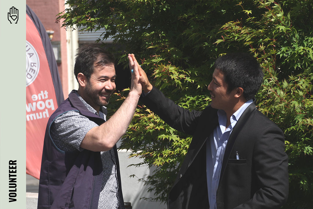 Two people partaking in a high five